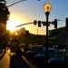 Sunset shining through the streets of Prescott AZ illuminating a Street lamp.
