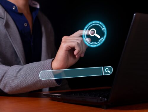 Man typing in a search engine, surfing the Internet and looking for information.